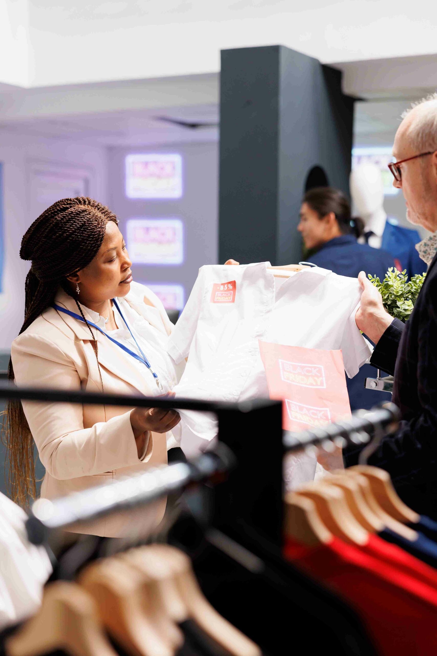 clothing-store-worker-helping-senior-man_11zon